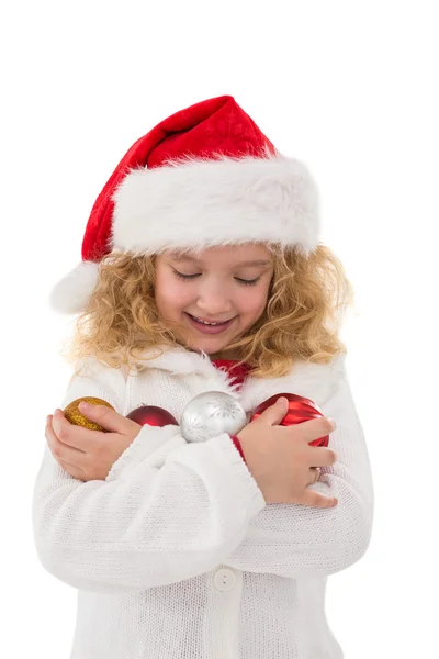 Niña festiva sosteniendo bolas —  Fotos de Stock