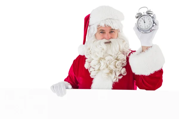 Santa claus holding alarm clock and sign — Stock Photo, Image