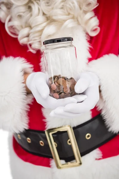 Santa holding kavanoz pennies tam — Stok fotoğraf