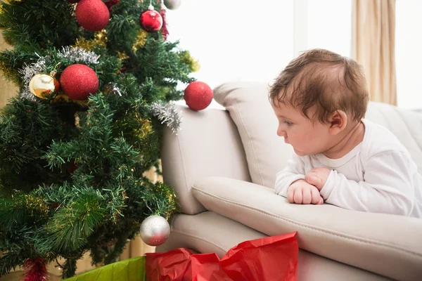 Cute baby boy on couch at christmas — Stock Photo, Image