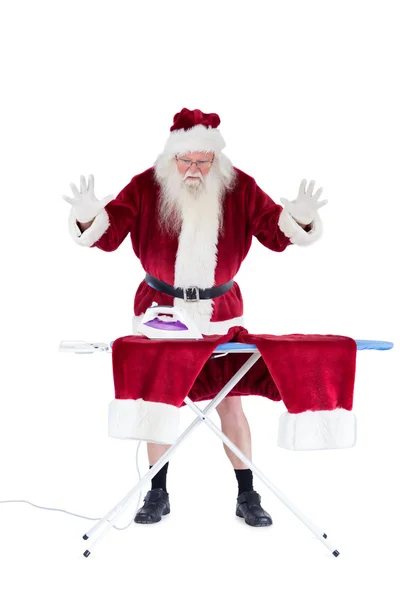 Santa is impressed about something on his pants — Stock Photo, Image