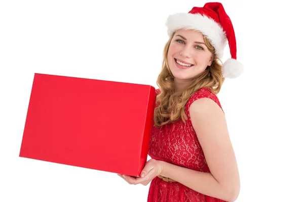 Pretty blonde in red dress holding a box — Stock Photo, Image