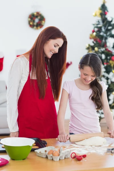 Festive mother and daughter baking together — Stock Photo, Image