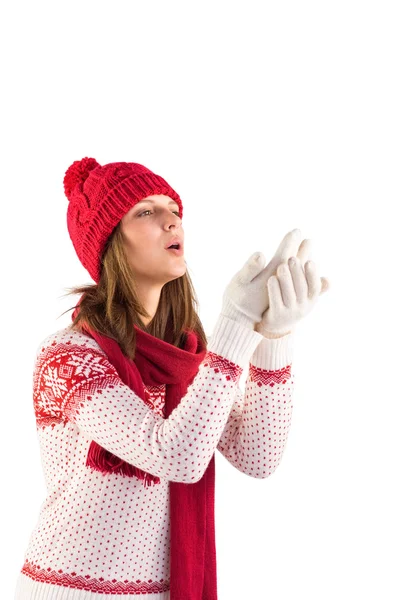 Woman in warm clothing blowing over hands — Stock Photo, Image