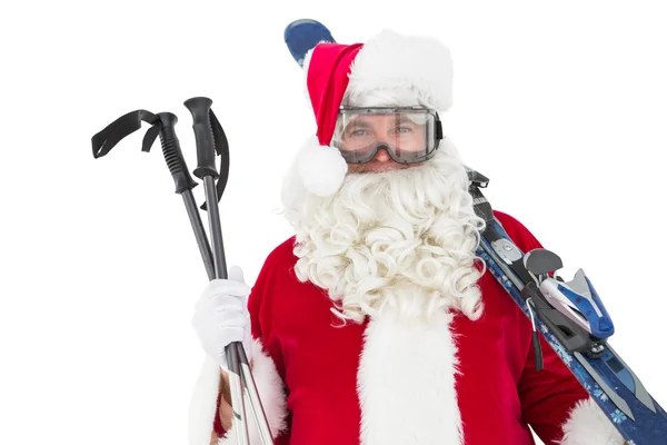 Happy santa poseren met ski en langlauf stokken — Stockfoto