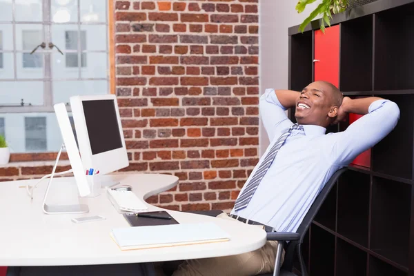 Thoughtful businessman at office desk — Stock Photo, Image