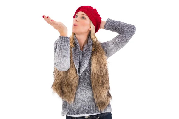 Blonde in winter clothes blowing kiss — Stock Photo, Image