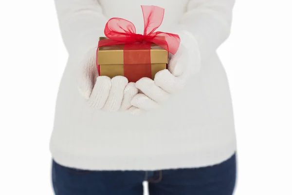 Woman in white gloves holding gift — Stock Photo, Image