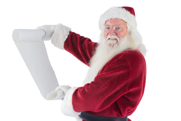 Father Christmas holds a list — Stock Photo, Image