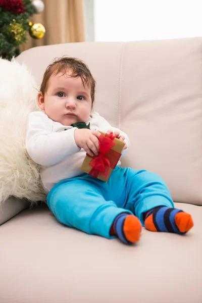 Cute baby boy on the couch at christmas — Stock Photo, Image