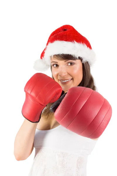 Festive brunette punching with boxing gloves — Stock Photo, Image