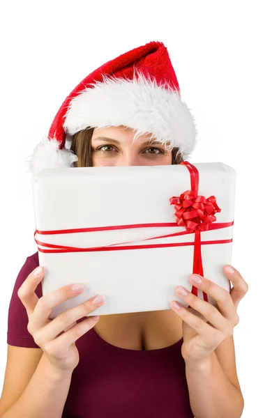 Festive brunette holding a gift — Stock Photo, Image