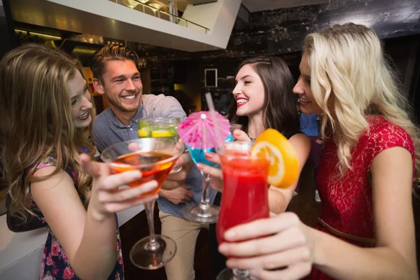 Happy friends having a drink together — Stock Photo, Image