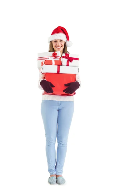 Festive young woman holding many gifts — Stock Photo, Image