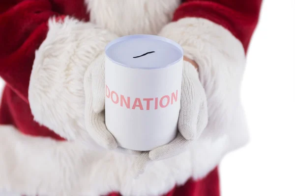 Santa innehar en kan för donationer — Stockfoto