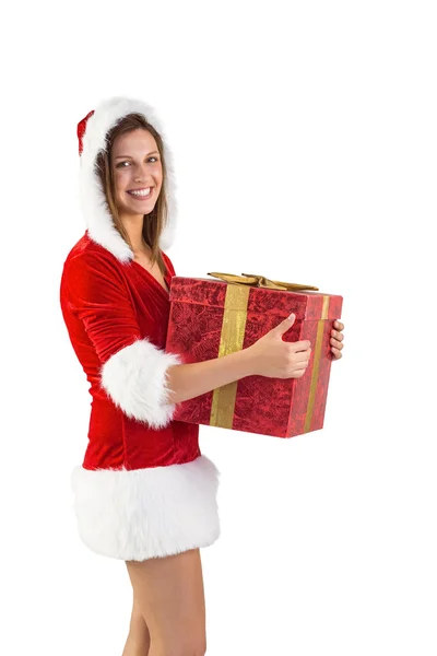 Menina festiva segurando um presente — Fotografia de Stock