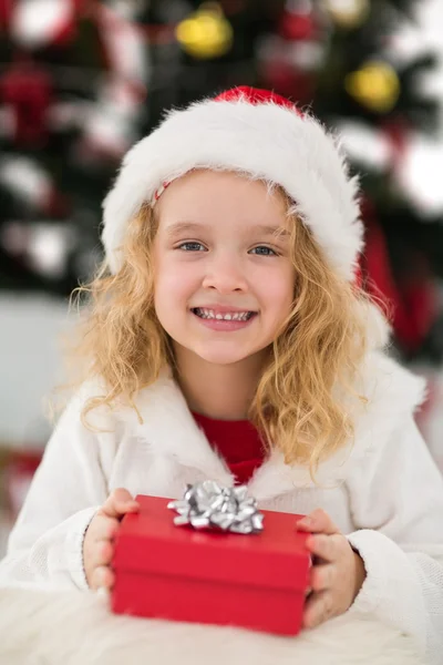 Festive little girl holding a gift Stock Photo