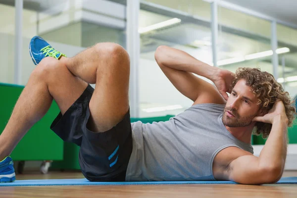 Handsome young man doing fitness exercise — Stock Photo, Image