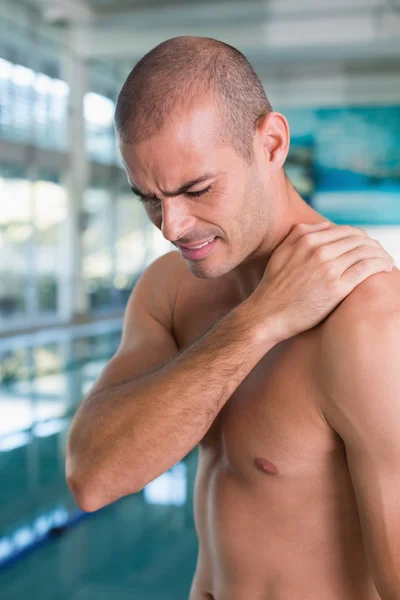 Shirtless fit swimmer by the pool at leisure center — Stock Photo, Image