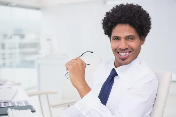 Handsome photo editor working at desk — Stock Photo, Image