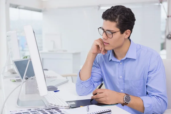Casual graphic designer working at his desk — Stock Photo, Image