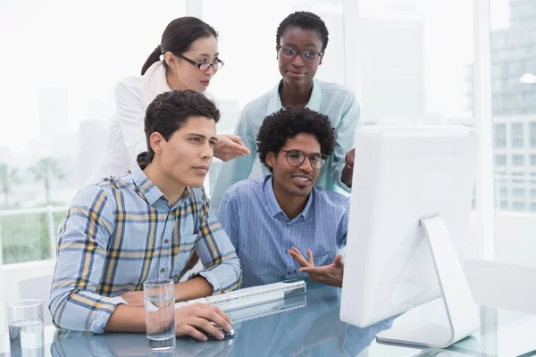 Casual business team working together at desk — Stock Photo, Image