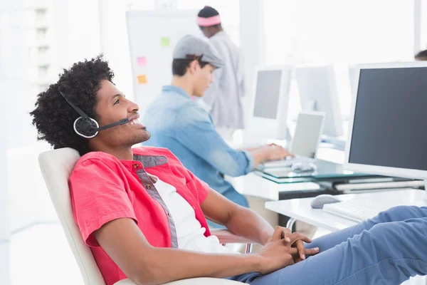 Young creative man listening to music — Stock Photo, Image