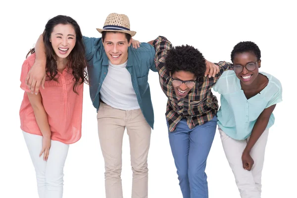 Stylish friends smiling at camera together — Stock Photo, Image