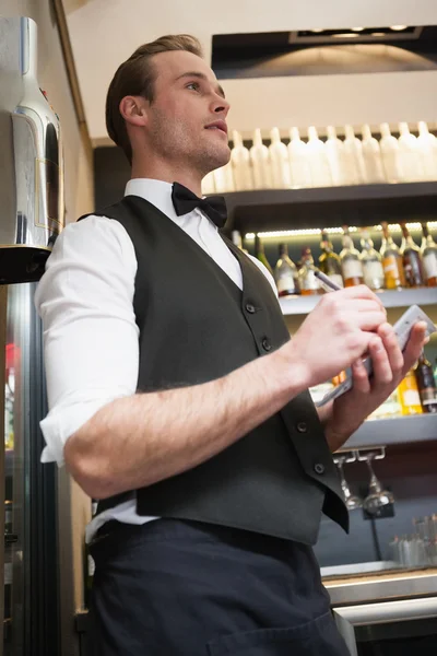 Waiter taking order in his notepad — Stock Photo, Image