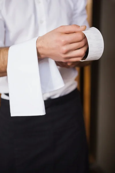 Handsome waiter reading a receipt — Stock Photo, Image