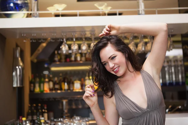 Pretty brunette dancing and smiling — Stock Photo, Image