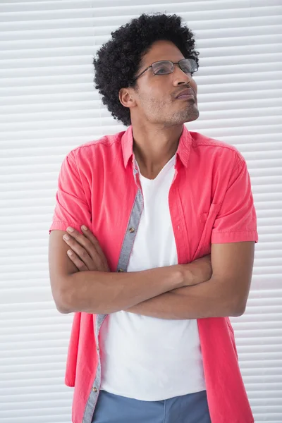 Thoughtful casual businessman with arms crossed — Stock Photo, Image