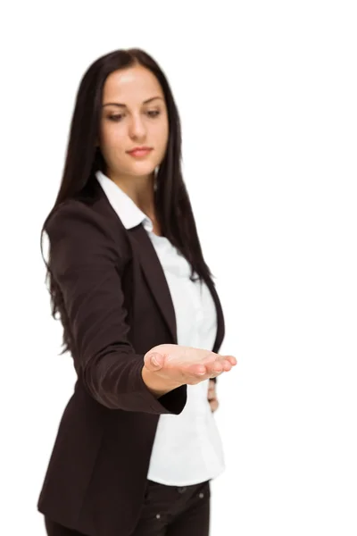 Pretty businesswoman presenting with hand — Stock Photo, Image