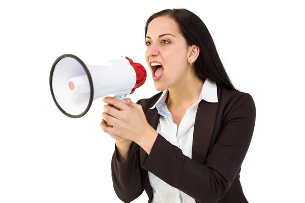 Pretty businesswoman shouting with megaphone — Stock Photo, Image