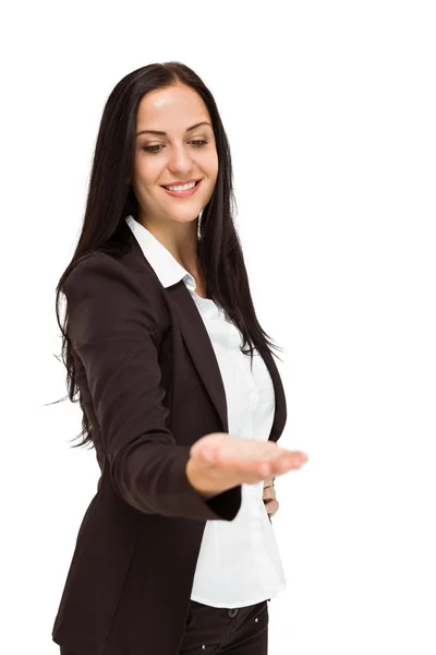 Pretty businesswoman presenting with hand Royalty Free Stock Images