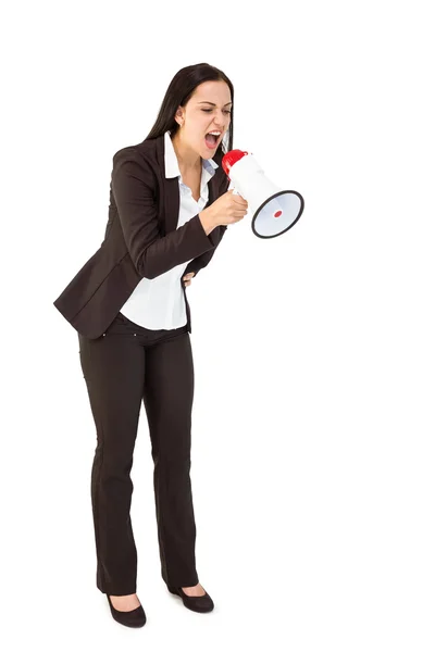 Pretty businesswoman shouting with megaphone Stock Picture