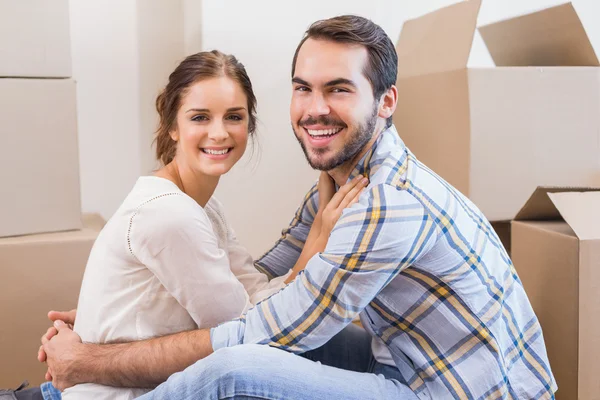 Cute couple sitting on the floor — Stock Photo, Image