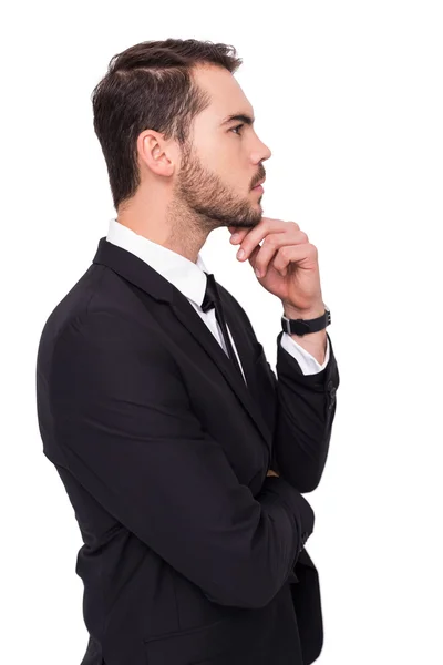 Promyšlené podnikatel dotýká bradě — Stock fotografie