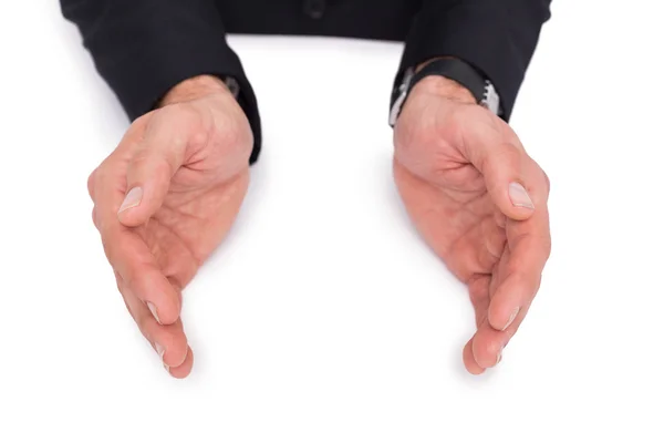 Close up of businessman with hands spread on the floor — Stock Photo, Image