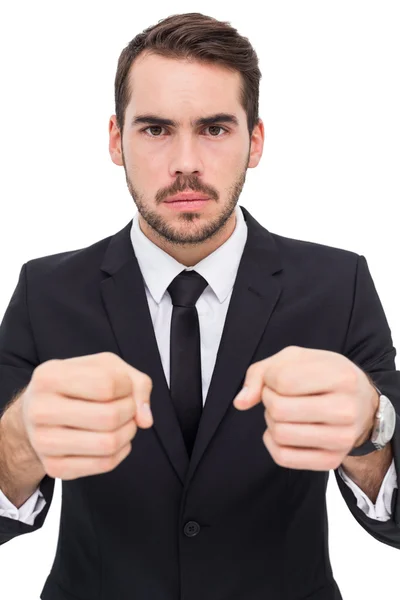 Frustrated businessman with closed fists looking at camera — Stock Photo, Image