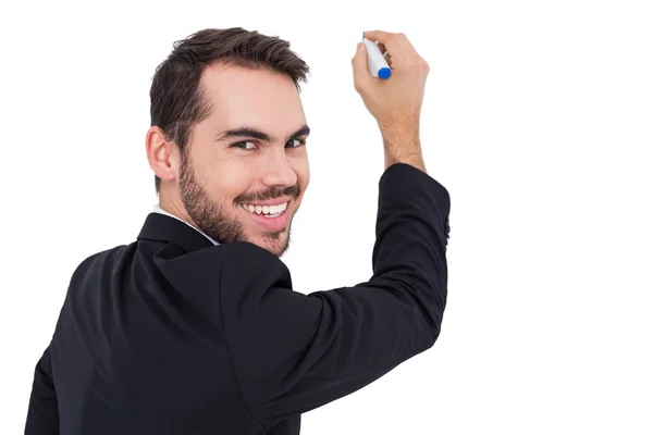 Happy businessman writing with marker — Stock Photo, Image