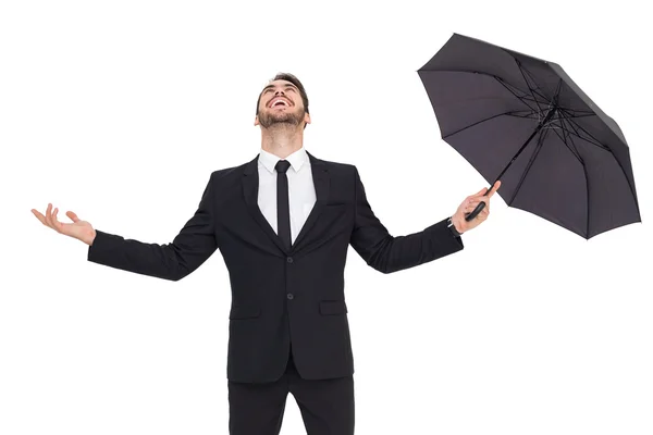 Gelukkig zakenman bedrijf paraplu — Stockfoto