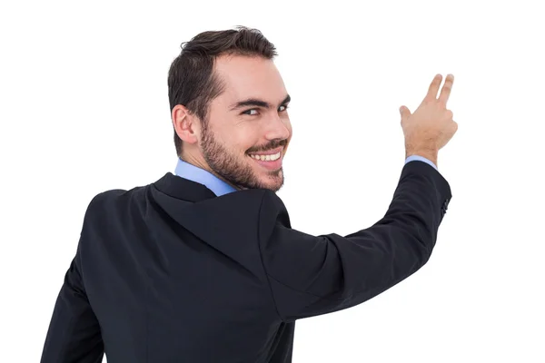 Smiling businessman pointing these fingers — Stock Photo, Image