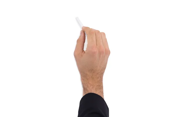 Mano de un hombre de negocios escribiendo con una tiza blanca — Foto de Stock