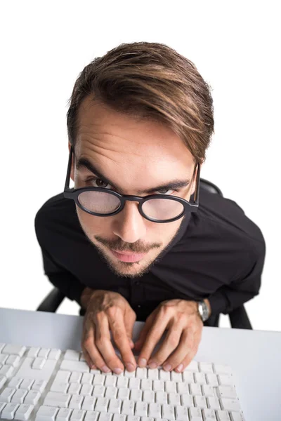 Portrait of a smiling businessman using computer — Stock Photo, Image