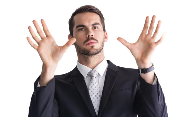 Serious businessman with finger spread out — Stock Photo, Image