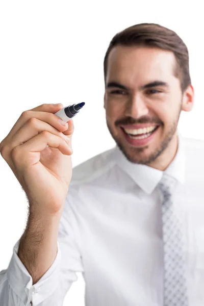 Happy businessman standing and writing with marker — Stock Photo, Image