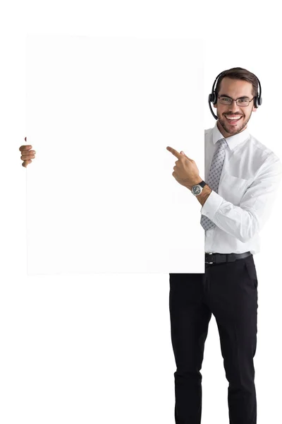 Hombre de negocios con auriculares apuntando signo a la cámara —  Fotos de Stock