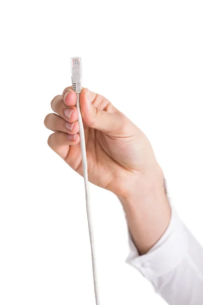 Hand of a businessman presenting white cable — Stock Photo, Image