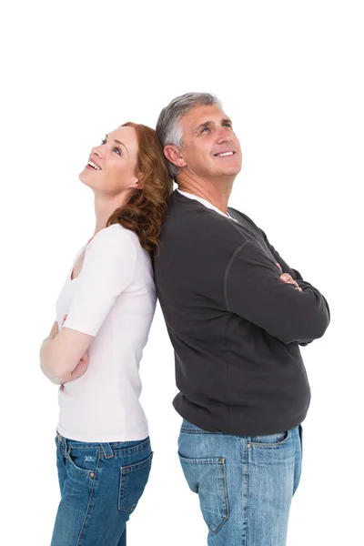 Casual couple smiling and looking up — Stock Photo, Image